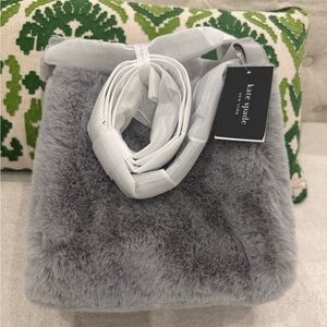 Kate Spade: Knott Faux Fur
NWT Tote Bags  328$